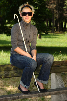 blind woman sitting on bench blind woman sitting on bench