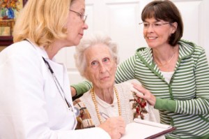 caregiver daughter with mom and Doctor